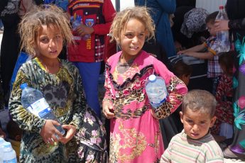 Displaced children in Hammam al-Aleel Camp, among some of the thousands continuing to flee Mosul, Iraq.