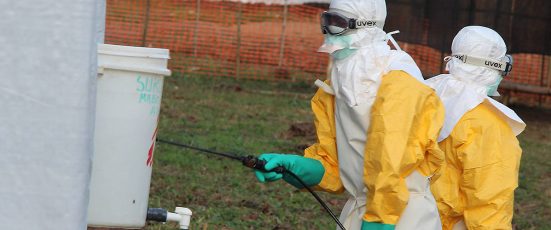 Hygienists disinfect treatment center facilities during a previous Ebola outbreak. Lokolia, Democratic Republic of the Congo