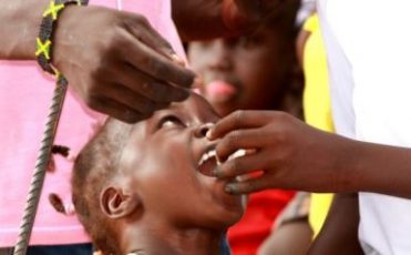 A child receives an oral cholera vaccine dose in the South Sudan.