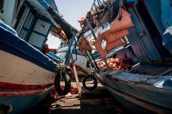 Boats used by Libyan smugglers to ferry Africans to international waters close to Italy, in a boat graveyard at a port in Pozzallo, Sicily