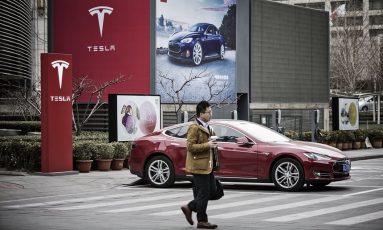 Electric cars, like this one in Beijing, could become more common in the region.