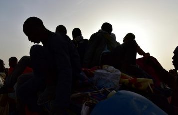 West African migrants returning from Niger after fleeing Libya due to armed groups by pickup truck in Agadez, northern Niger, following their failed attempt to reach Europe by crossing the Mediterranean Sea.