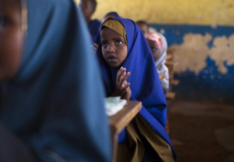 Children sing a song of welcome at a primary school in Dagahale, one of several refugee settlements in Dadaab, Garissa County, northeastern Kenya.