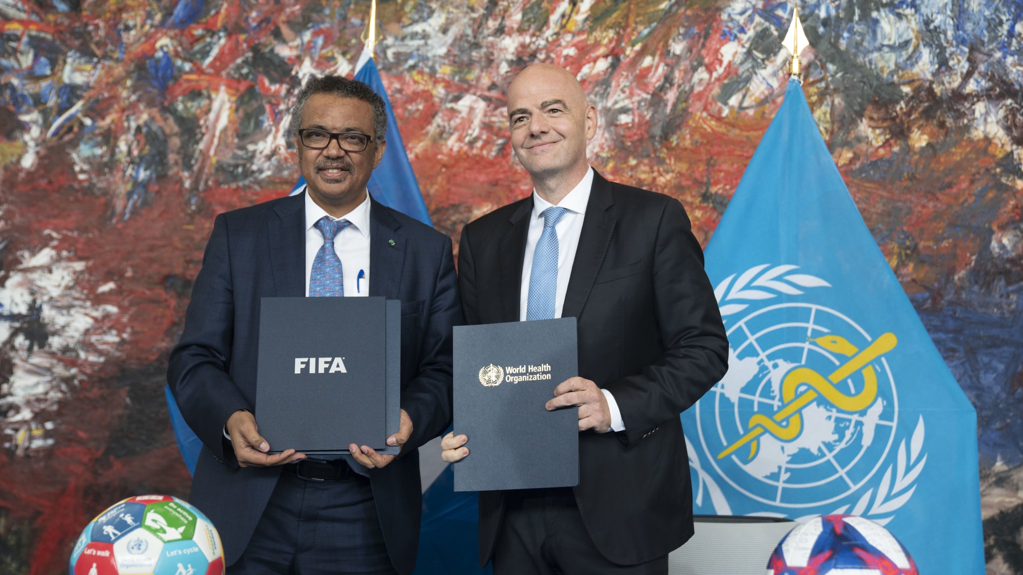 WHO/ Christopher Black Dr Tedros and FIFA President Gianni Infantino