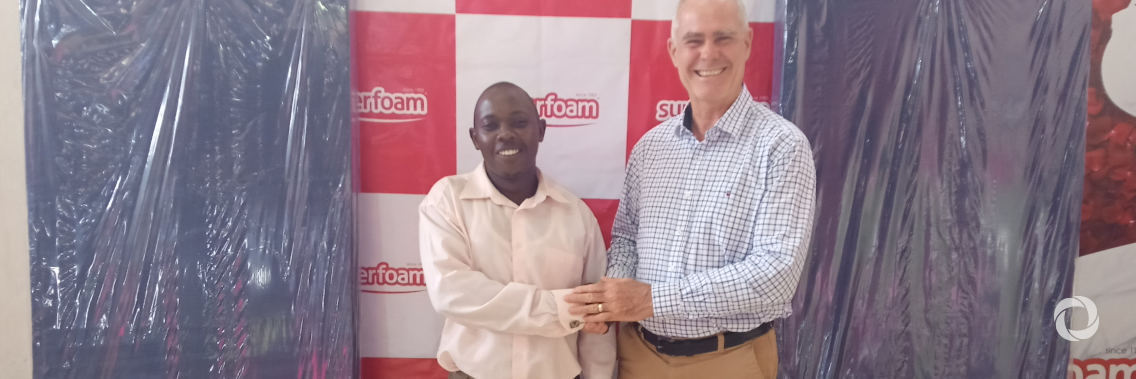 Superfoam Limited CEO Mike Fisher handing over the donation to Kapedo Secondary School Representative
