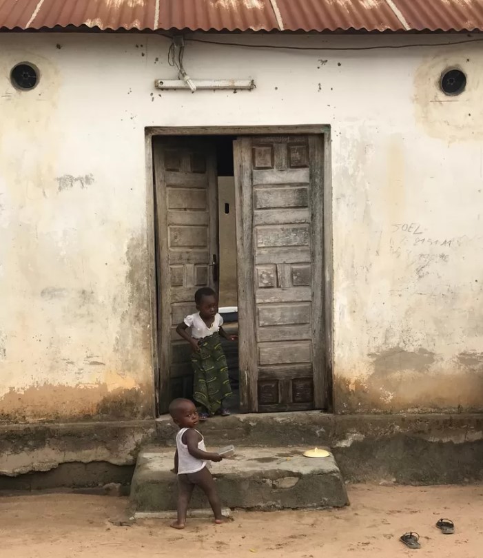 A house in Ivory Coast with the new mosquito killers on the round holes above the door.Image In2Care